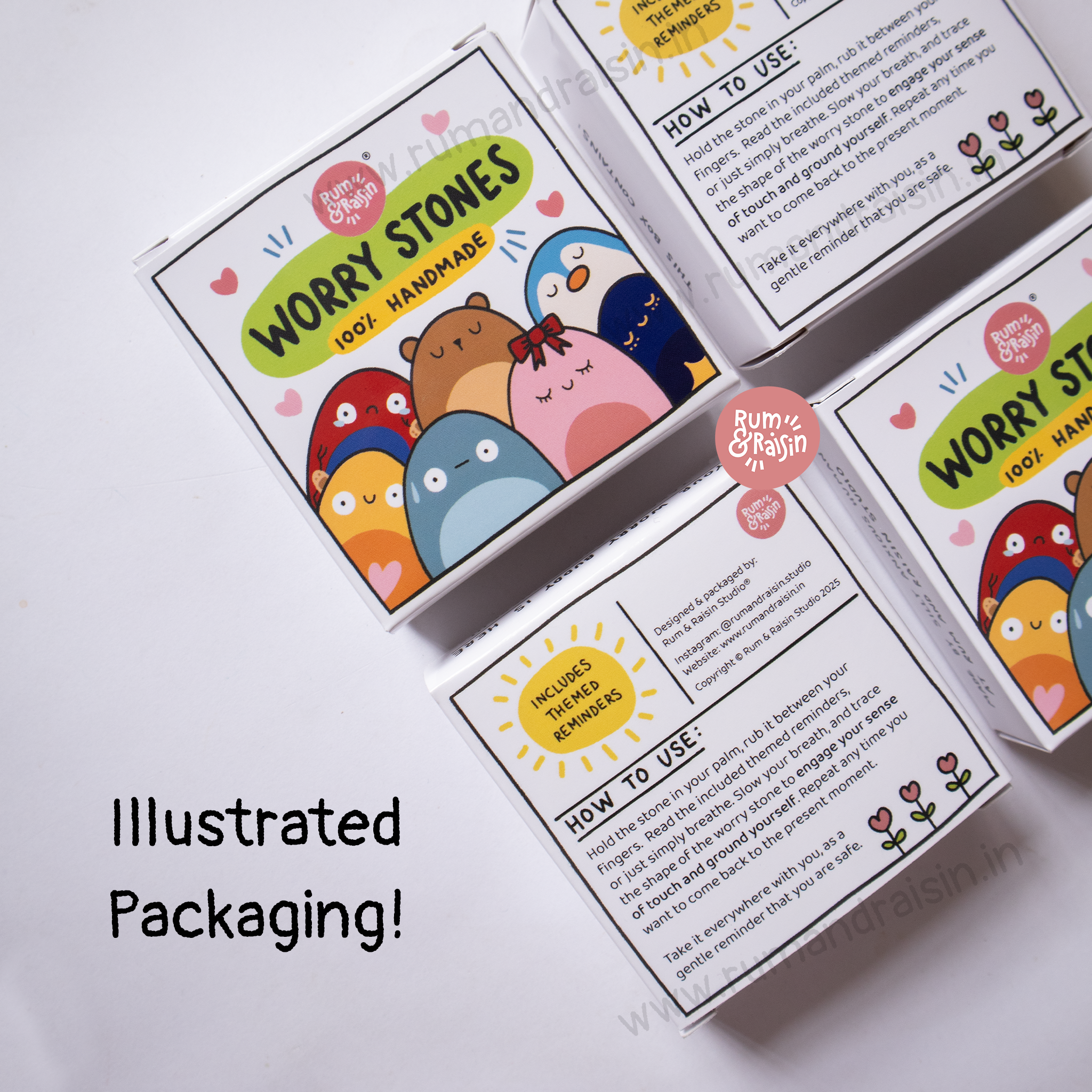 Worry stone set with colorful packaging on a white background