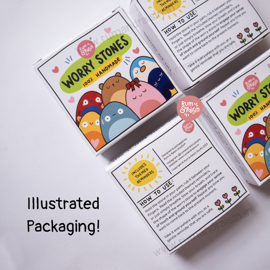 Worry stone set with colorful packaging on a white background