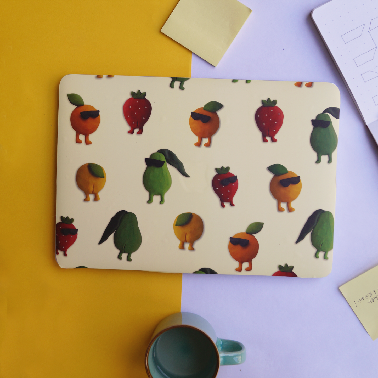 colourful laptop skin with clay illustrations of fruits 