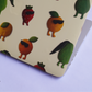 close up of laptop skin with colour fruit illustrations